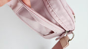 Pochette rose avec dragonne